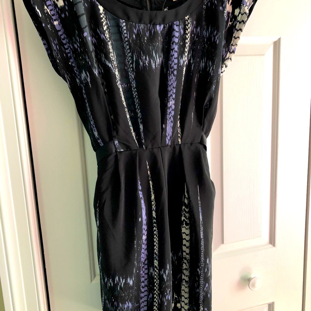 Black stylish dress featuring zipper down back